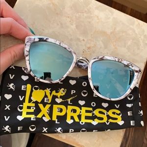 Reflective marble print and blue lense sunglasses